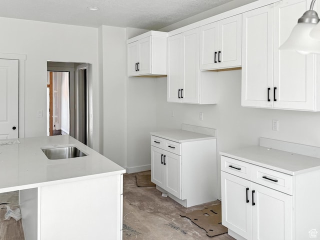 8239 W Joshua Tree Ln, Magna, UT 84044 - kitchen with white cabinetry and light countertops