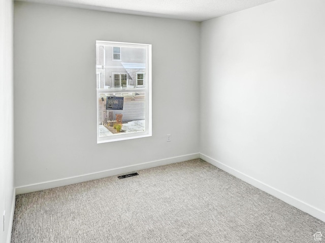 8239 W Joshua Tree Ln, Magna, UT 84044 - spare room featuring carpet floors and baseboards