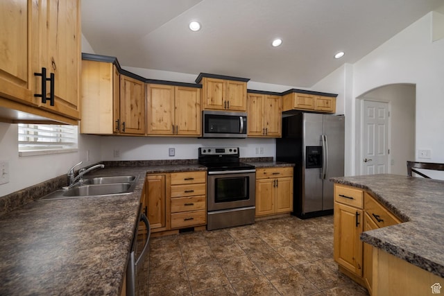 392 E 2900 S, Vernal, UT 84078 - kitchen featuring appliances with stainless steel finishes, dark countertops, vaulted ceiling, recessed lighting, and arched walkways