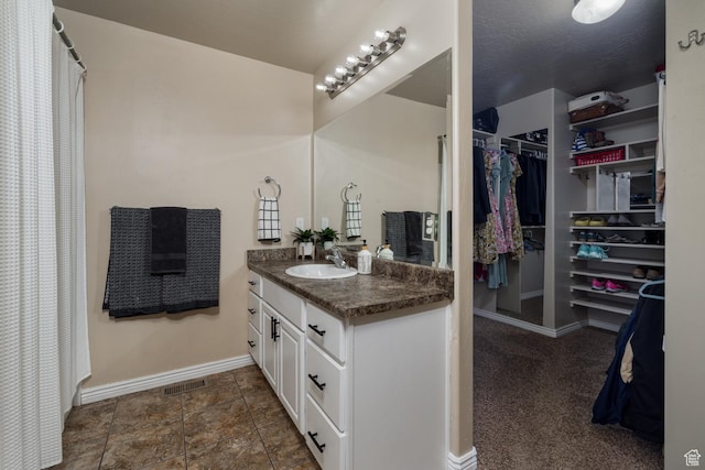392 E 2900 S, Vernal, UT 84078 - bathroom with vanity and a walk in closet