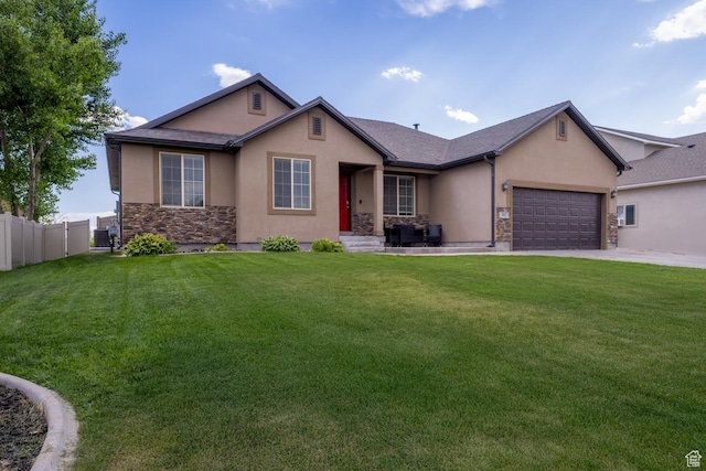 392 E 2900 S, Vernal, UT 84078 - view of front of property with stucco siding, stone siding, and an attached garage