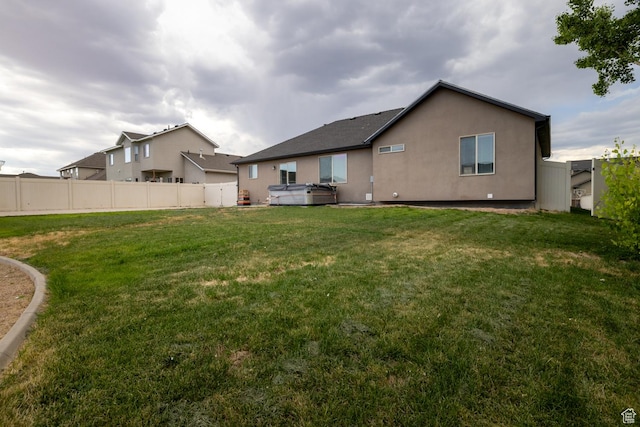 392 E 2900 S, Vernal, UT 84078 - rear view of property with a hot tub and stucco siding