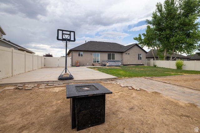 392 E 2900 S, Vernal, UT 84078 - back of property featuring a fire pit, a patio area, a fenced backyard, a gate, and stucco siding