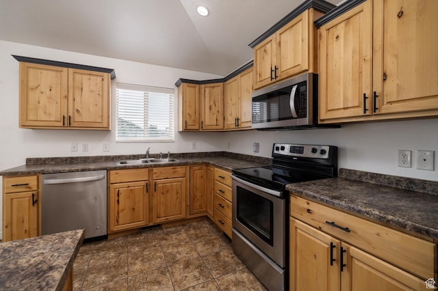 392 E 2900 S, Vernal, UT 84078 - kitchen featuring appliances with stainless steel finishes, vaulted ceiling, and dark countertops