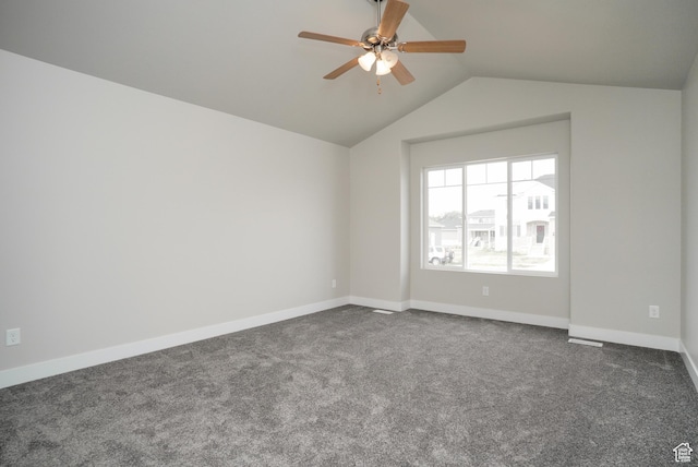 3045 S 2275 W, West Haven, UT 84401 - spare room with vaulted ceiling, dark colored carpet, and a ceiling fan