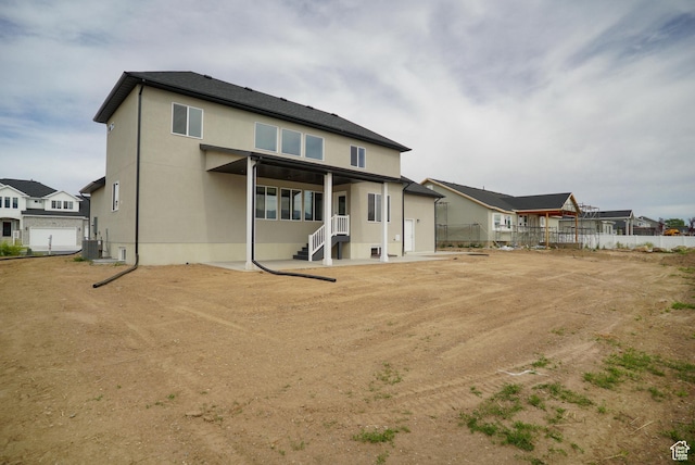3045 S 2275 W, West Haven, UT 84401 - rear view of property with stucco siding and a patio