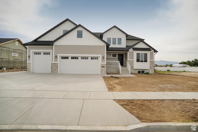 3045 S 2275 W, West Haven, UT 84401 - craftsman-style house with concrete driveway, board and batten siding, and stone siding