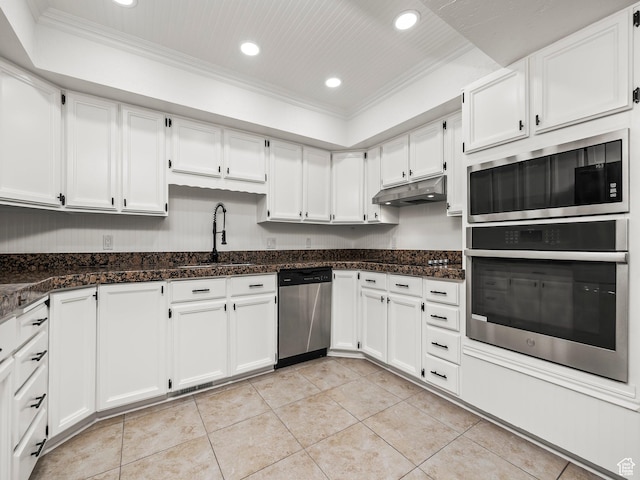 3818 N Little Rock Ct E, Provo, UT 84604 - kitchen featuring appliances with stainless steel finishes, ornamental molding, under cabinet range hood, recessed lighting, and white cabinetry