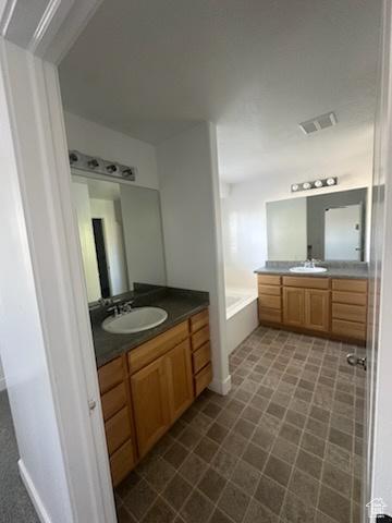 12228 S Madison View Dr, Riverton, UT 84065 - full bathroom with two vanities and a bathtub