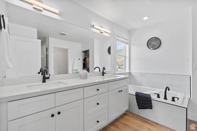 723 W 800 S, Springville, UT 84663 - full bathroom with double vanity, a garden tub, and wood finished floors