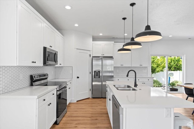 723 W 800 S, Springville, UT 84663 - kitchen featuring stainless steel appliances, a breakfast bar area, light countertops, white cabinetry, and recessed lighting