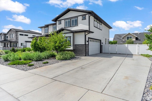 723 W 800 S, Springville, UT 84663 - view of front of property featuring a garage, driveway, a residential view, a gate, and brick siding