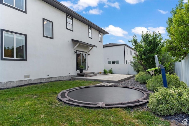 723 W 800 S, Springville, UT 84663 - rear view of property featuring a trampoline, stucco siding, a patio, and crawl space
