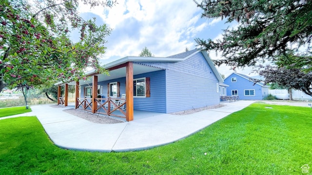 325 S 100 W, Garden City, UT 84028 - view of side of property with a lawn and a porch