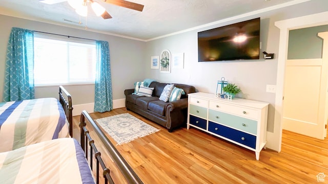 325 S 100 W, Garden City, UT 84028 - bedroom with light wood-style flooring, crown molding, and a ceiling fan