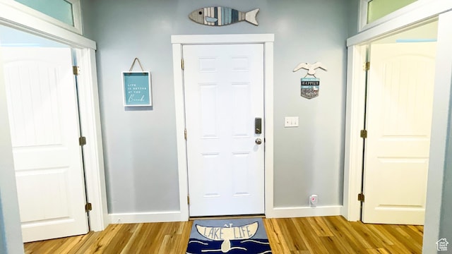 325 S 100 W, Garden City, UT 84028 - foyer entrance with light wood-style floors and baseboards