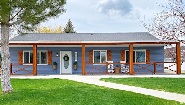 325 S 100 W, Garden City, UT 84028 - bungalow with a porch, a front lawn, and roof with shingles