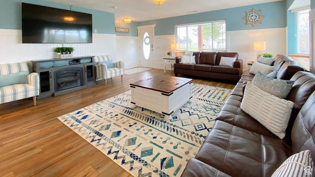 325 S 100 W, Garden City, UT 84028 - living room with wainscoting, wood finished floors, and healthy amount of natural light