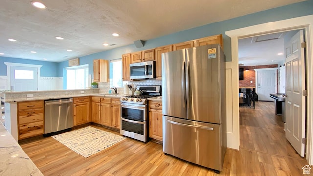 325 S 100 W, Garden City, UT 84028 - kitchen with stainless steel appliances, light wood-style flooring, light brown cabinetry, and recessed lighting