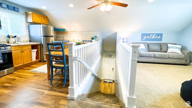 325 S 100 W, Garden City, UT 84028 - stairway with a ceiling fan, wood finished floors, vaulted ceiling, and recessed lighting
