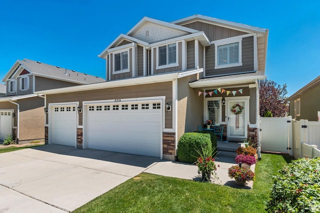 5319 W Elsmere Ln S, Herriman, UT 84096 - craftsman house featuring concrete driveway, board and batten siding, and a garage