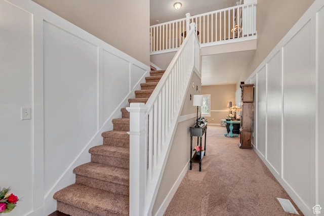 5319 W Elsmere Ln S, Herriman, UT 84096 - staircase with carpet flooring and a towering ceiling