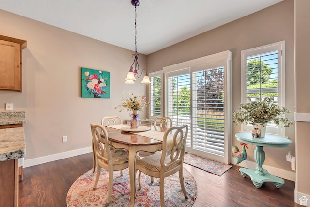 5319 W Elsmere Ln S, Herriman, UT 84096 - dining space with healthy amount of natural light and dark wood-style floors