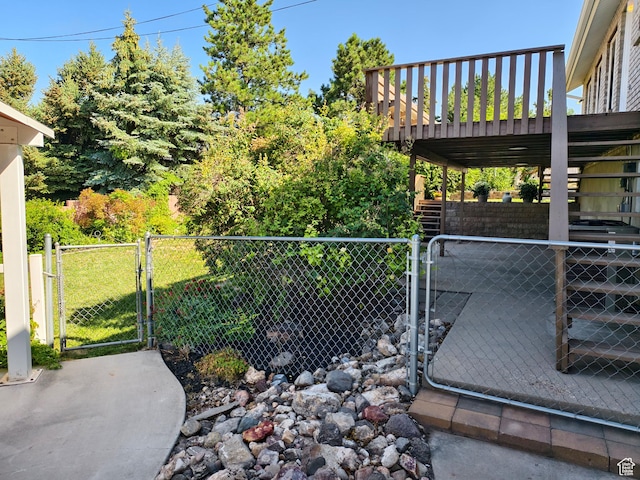 411 S Ridge Rd, Cedar City, UT 84720 - view of yard with a gate, stairway, and a wooden deck