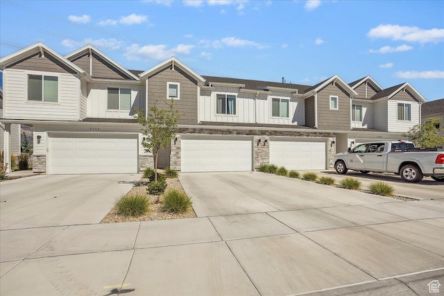 3270 N 3325 W Unit 386B, Plain City, UT 84404 - craftsman-style house with stone siding, driveway, a garage, and board and batten siding