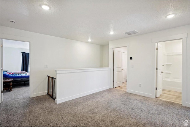 3270 N 3325 W Unit 386B, Plain City, UT 84404 - empty room with carpet flooring, a textured ceiling, a smoke detector, and recessed lighting