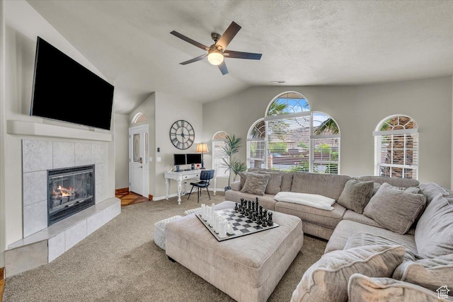 2045 S 1400 E Unit 8, St George, UT 84790 - carpeted living area featuring a ceiling fan, vaulted ceiling, and a tiled fireplace