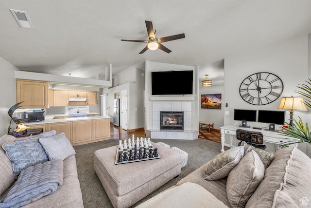 2045 S 1400 E Unit 8, St George, UT 84790 - carpeted living room featuring a ceiling fan, a tile fireplace, and vaulted ceiling