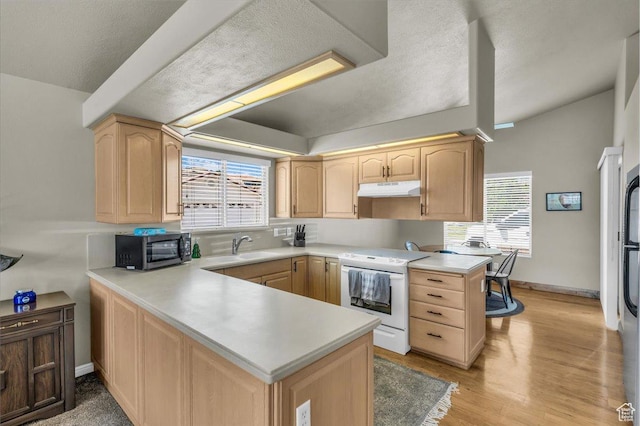 2045 S 1400 E Unit 8, St George, UT 84790 - kitchen with white electric range, light brown cabinetry, under cabinet range hood, and a peninsula