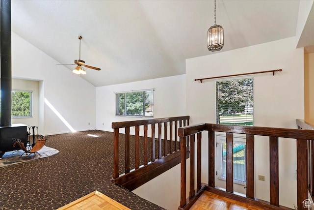 484 E 3450 N, North Ogden, UT 84414 - staircase featuring a wood stove, healthy amount of natural light, a ceiling fan, and high vaulted ceiling
