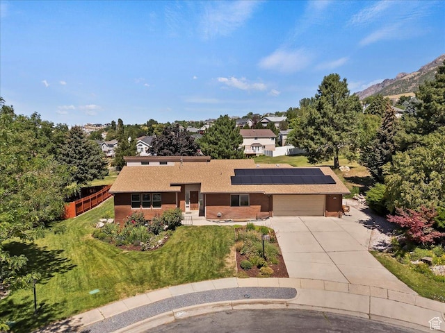 484 E 3450 N, North Ogden, UT 84414 - view of front of home featuring driveway, roof mounted solar panels, and a garage