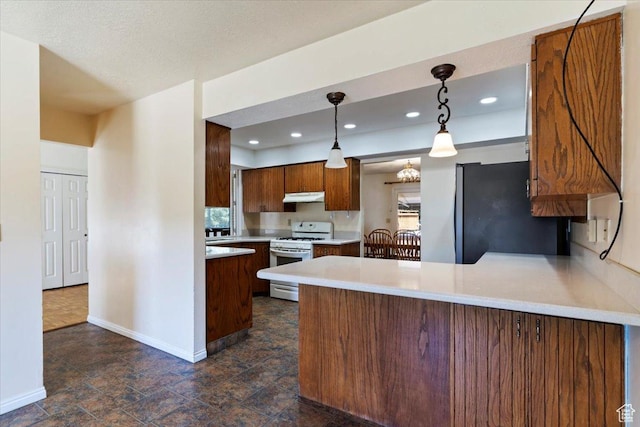484 E 3450 N, North Ogden, UT 84414 - kitchen featuring white gas range oven, freestanding refrigerator, a peninsula, light countertops, and under cabinet range hood