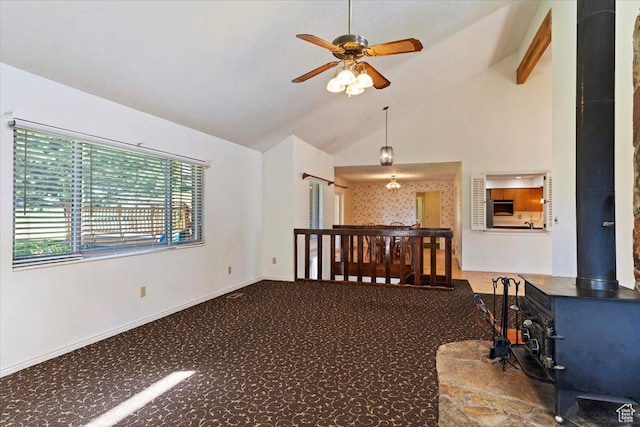 484 E 3450 N, North Ogden, UT 84414 - unfurnished room with a wood stove, a ceiling fan, vaulted ceiling, and carpet