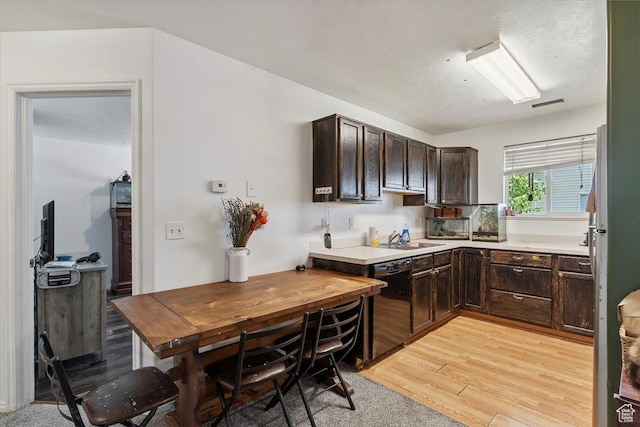 2421 N 400 E Unit C4, North Ogden, UT 84414 - kitchen featuring black dishwasher, dark brown cabinetry, light wood-style floors, and light countertops
