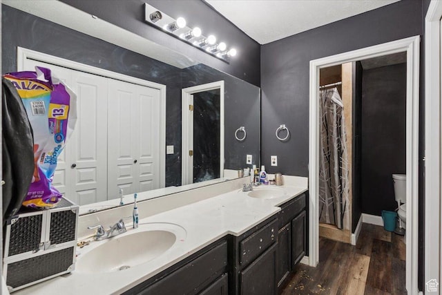 2421 N 400 E Unit C4, North Ogden, UT 84414 - bathroom featuring double vanity and wood finished floors