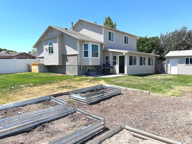 4086 W Wind River Dr, West Jordan, UT 84088 - back of house with a garden and a storage unit
