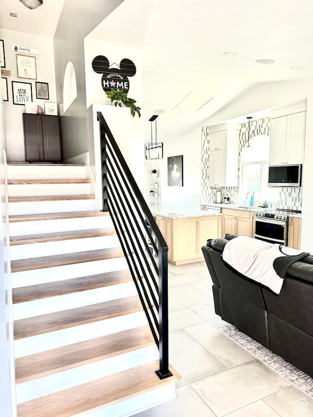 4086 W Wind River Dr, West Jordan, UT 84088 - stairway featuring lofted ceiling