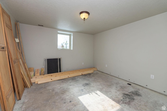 9115 W 25800 N, Portage, UT 84331 - spare room with concrete floors and a textured ceiling