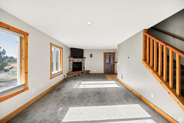 9115 W 25800 N, Portage, UT 84331 - unfurnished living room featuring a fireplace, carpet, stairs, and recessed lighting
