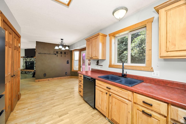 9115 W 25800 N, Portage, UT 84331 - kitchen featuring black dishwasher, dark countertops, a chandelier, and light wood-type flooring