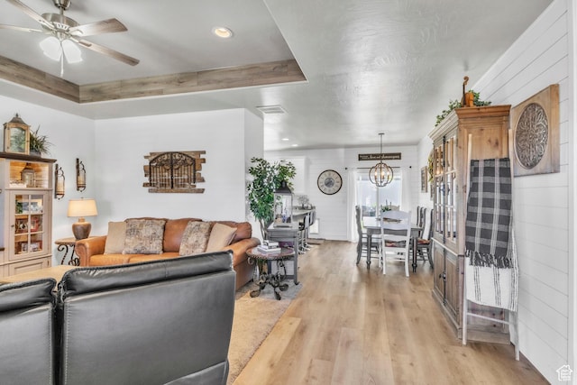 1188 N 100 E, Nephi, UT 84648 - living area featuring light wood-style floors, a chandelier, a ceiling fan, and recessed lighting