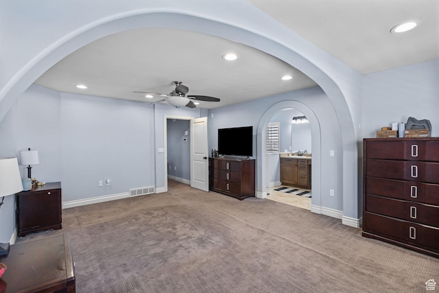4467 W 5850 S, Hooper, UT 84315 - living area featuring arched walkways, recessed lighting, a ceiling fan, and carpet