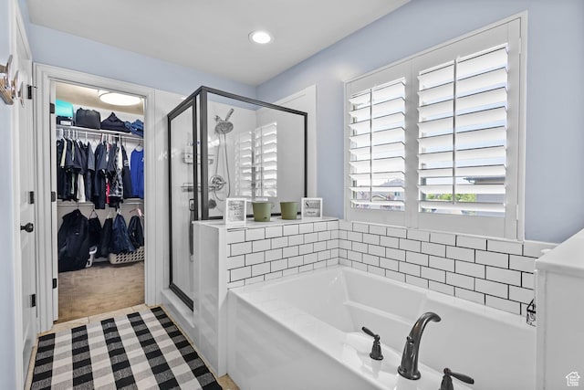4467 W 5850 S, Hooper, UT 84315 - bathroom with a garden tub, a stall shower, a spacious closet, and recessed lighting