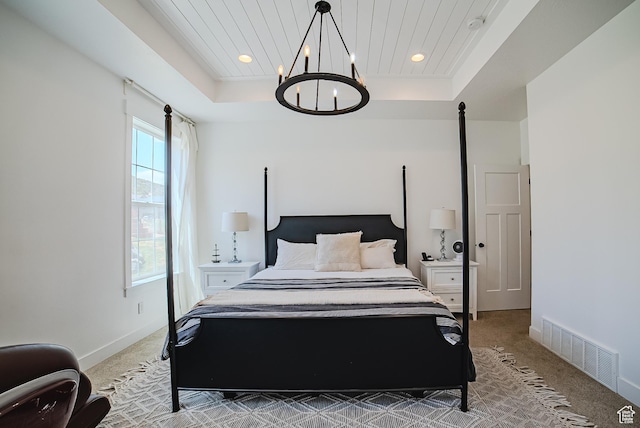 3698 E Butterfield Rd, Eagle Mountain, UT 84005 - bedroom with light colored carpet, a raised ceiling, a chandelier, and recessed lighting