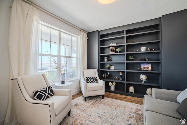 3698 E Butterfield Rd, Eagle Mountain, UT 84005 - sitting room with wood finished floors and built in shelves