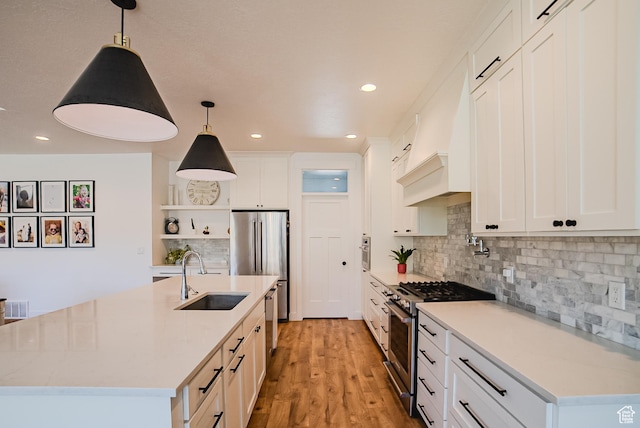 3698 E Butterfield Rd, Eagle Mountain, UT 84005 - kitchen featuring stainless steel appliances, open shelves, recessed lighting, white cabinetry, and a center island with sink